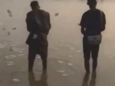 Moment yahoo boys were spotted spraying money into river (Video)