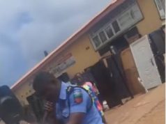 “Double your hustle they say” – Reactions as policeman is spotted preaching the gospel on the street (Video)